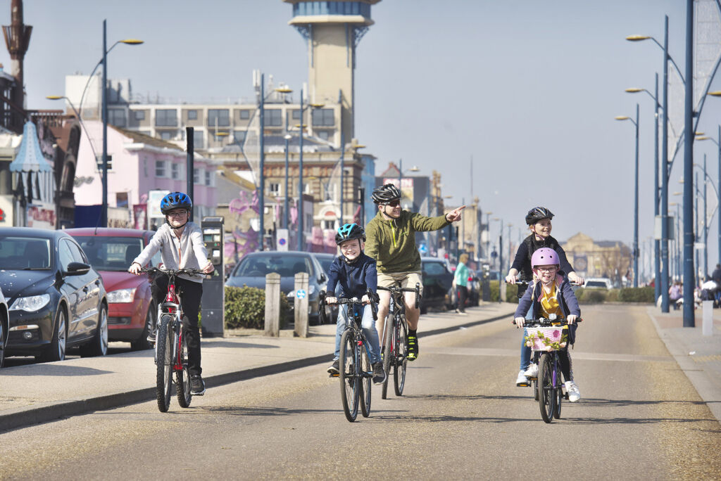 Decorative - Family on bicycles on seafront